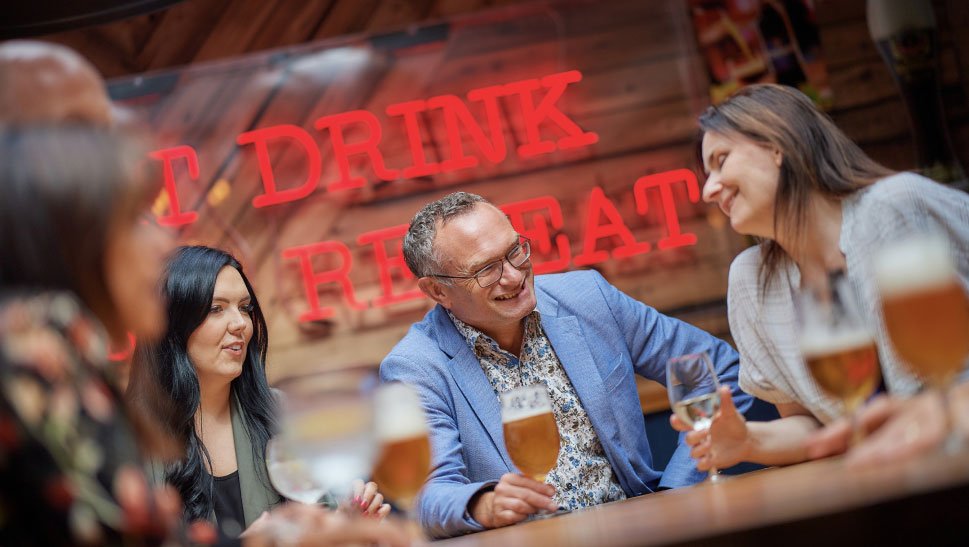 People drinking alcohol in a pub