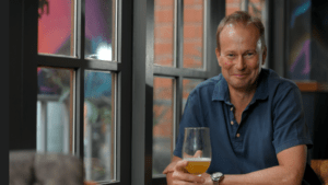 Man drinking alone in a pub