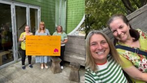 Practice manager and partner (non-solicitor), Tracey Robottom and secretary, Sue Deacon captured presenting a cheque of £1,263 to Maggie's centre fundraiser, Alexa Wigfield.